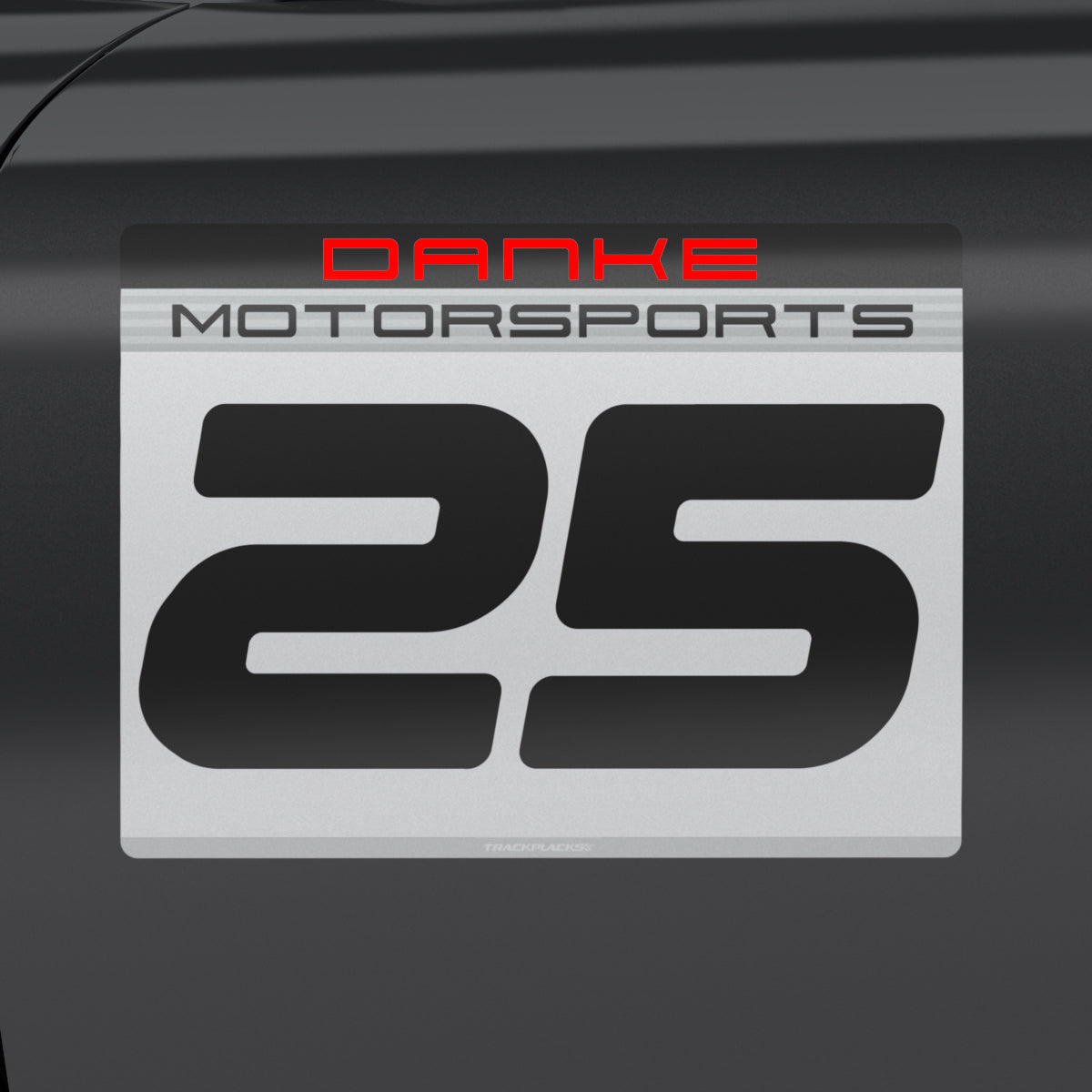 rackPlacks PMS Grid Plate 3-digit racing number plate in silver and black with custom team name Danke in red Motorsports and driver number 25 applied to car door
